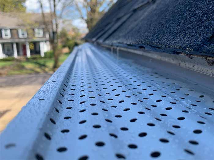 white gutter rx perforated gutter guards installed on 6" gutters