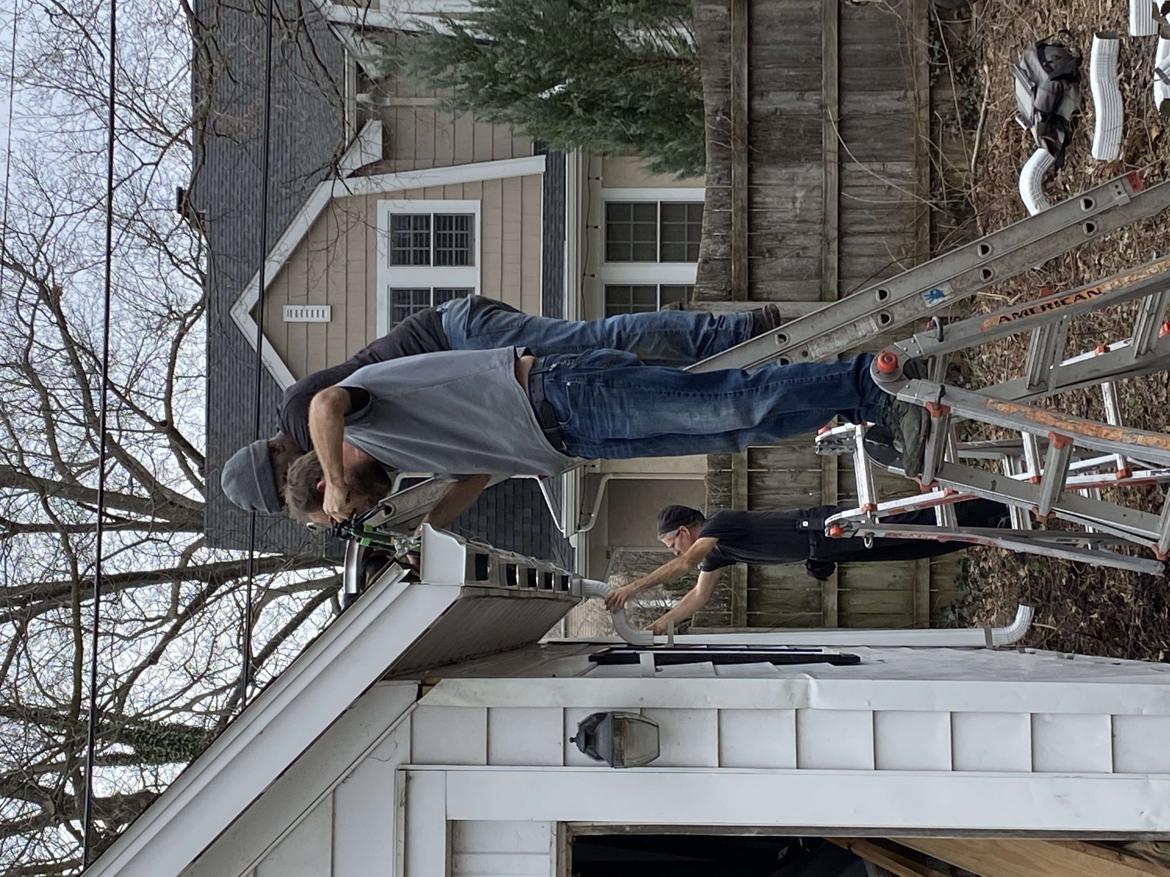 installing new 6" gutters, sealing end caps and installing downspouts on a detached garage